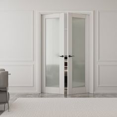 an empty white room with two chairs and a glass door leading to another room in the background