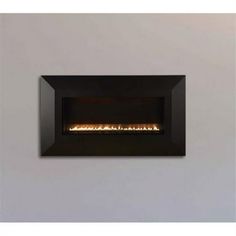 the wall mounted fireplace is lit up and ready to be used in any home or office