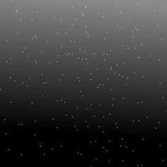 an abstract black and white background with small dots