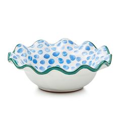 a white bowl with blue polka dots on it