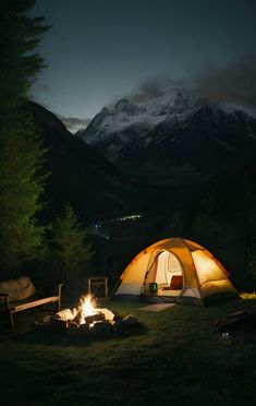 a tent set up in the middle of a forest at night with a campfire