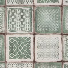 green and white tiles with different designs on them