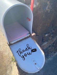 a mailbox with the word thank you written on it