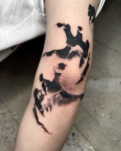 a person with a tattoo on their arm