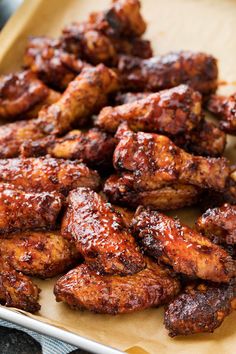 some chicken wings are sitting on a tray