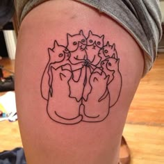 a woman's thigh with cats on it