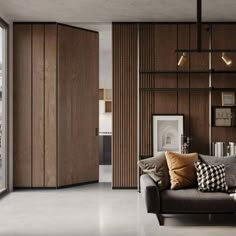 a living room filled with furniture next to a large glass window covered in lots of books