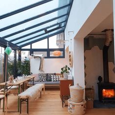 a living room filled with furniture and a fire place