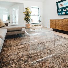 20 clear acrylic coffee table with waterfall edges sitting on a living room area rug in front of a couch. Lucite Coffee Table, Waterfall Coffee Table, Lucite Table, Acrylic Coffee Table, Acrylic Furniture, Long Shelf, Coffee Tables For Sale, Acrylic Table, Glass Cleaner