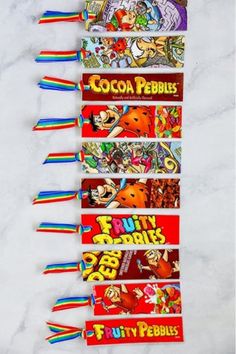 five candy bars lined up on top of each other with the names cocoa pebbles