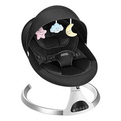 a baby seat with three cartoon faces hanging from it's back and on the armrest