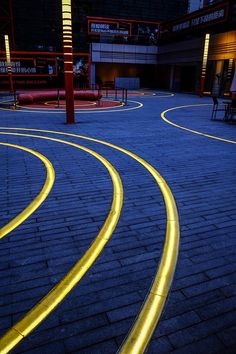 yellow lines on the ground in front of a building