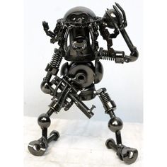 Metal Scrap Art Nuts, Bolts, Screws, Washers, Bearings, Etc Are Put Together To Create This Awesome Alien Looking Robot Welded Together And Polished In Black, This Definitely A Statement Piece The Chain Pieces That Make The Hair Are Moveable Weight: 1 Lb 2 Oz Approx: Height: 8" (20.3 Cm) Leg Span: 6" (15.2 Cm) Depth: 3" (7.5 Cm) Metal Scrap Art, Alien Robot, Art Alien, Robot Sculpture, Scrap Art, Nuts & Bolts, Nuts Bolts, Statement Pieces, Nuts