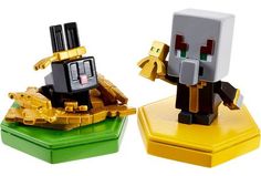 two small toy figurines sitting on top of green and yellow bases, one holding a cell phone