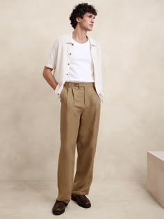 This relaxed pant is expertly cut with a wide leg and puddle hem in a beautiful linen-blend fabric we sourced from Italy, one we selected for its subtle texture and exceptional drape.  Relaxed fit: Mid rise.  Wide leg with extra length for a break at the hem Fabric from Italy's Lanificio Comatex.  Zip-fly with button closure.  Belt loops.  Front and back pockets.  Half lined (lined to the knee).  Wide-leg fit: Mid rise.  Tailored for the at-ease fit of traditional trousers, but with the extra wide-leg and full length of puddle-hem pants.  Wide leg opening measures 20".  Model: Size 32 Regular, 6'2" (188cm). Academia Summer Outfit, Trousers Outfit Men, Mens Linen Outfits, Linen Pants Outfit, Pants Outfit Men, Linen Blend Pants, Mens Linen, How To Hem Pants