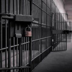 a jail cell with two padlocks on it