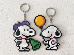 two keychains made to look like cartoon characters