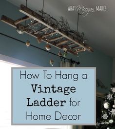 a living room with a christmas tree in the corner and text overlay that reads how to hang a vintage ladder for home decor