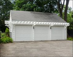 two garages are shown in front of a house