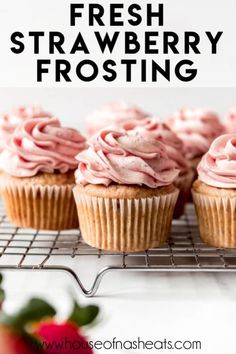 fresh strawberry frosting on top of some cupcakes