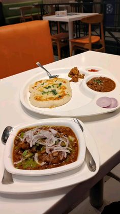 two plates of food on a table in a restaurant