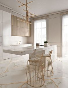 a kitchen with marble counter tops and gold barstools