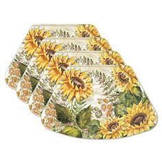 four sunflowers on white place mats