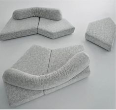 three pieces of furniture made out of felt on a white surface, including one sofa and the other chair