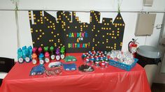 a red table topped with lots of candy