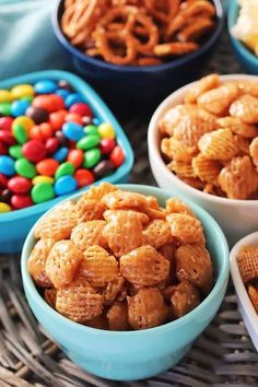 several bowls filled with different types of cereal