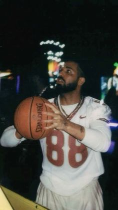 a man holding a basketball in his right hand