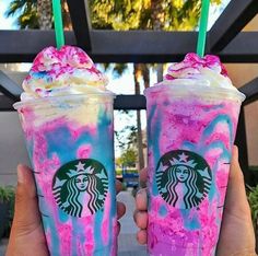 two starbucks drinks with pink and blue swirled toppings