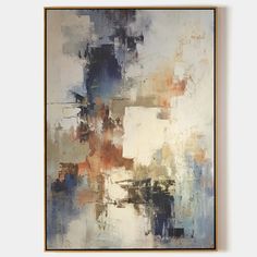 an abstract painting with blue, orange and white colors on the wall in a gold frame