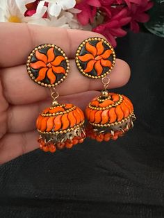 Complete your look this festive season with our lightweight and colorful chandelier jhumka earrings in orange color and antique polish! A gorgeous pair of jhumka earrings to light up your day any time! In stock and ready to ship. Color : orange Note :Color, shades, texture displayed may slightly vary from the actual product due to digital image limitations. We request you to consider these minor variations. Please expect the possibility of some slight imperfections when buying handmade jewelry. Orange Earrings Indian, Small Jhumka, Colorful Chandelier, Pakistani Earrings, Earrings Kundan, Navratri Collection, Terracotta Earrings, Jewelry Pakistani, Kundan Jewelry