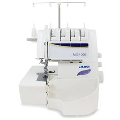 the juki mo - 100 sewing machine is white and has blue trimmings