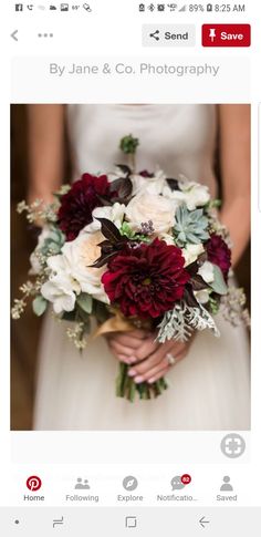 a woman holding a bouquet of flowers on her wedding day