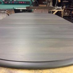 an image of a table that is in the process of being polished and painted silver