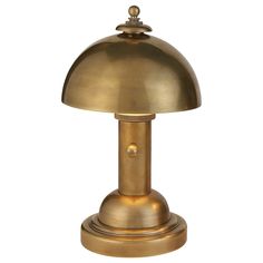 an antique brass table lamp on a white background