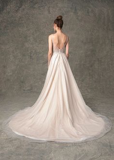 a woman in a wedding dress looking back