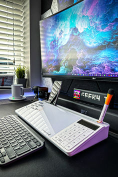 a keyboard, mouse and monitor sitting on a desk in front of a computer screen