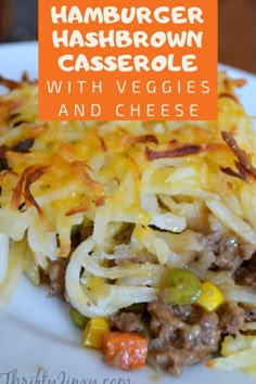 hamburger hashbrown casserole with veggies and cheese on a white plate