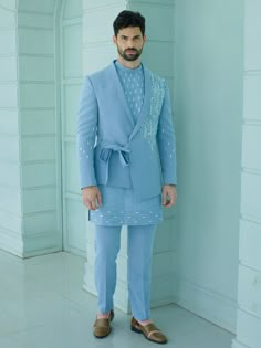 Blue Colour Handcrafted Designer Indowestern for groom or family & friends with elegant kurta inside made from the finest fabric will make you feel like a king on the happiest & most important day of your life.you can customize it according to your measurement as the fitting make it more beautiful to wear.Its beautifully hand embroidered and zari work on blazer & kurta,indowestern for men,indo western dress for men COST INCLUDED SHERWANI ,TROUSER & KURTA AS IN THE PICTURE New Dress Designs For Men, Indowestern Groom Outfit, Fitted Blue Kurta For Groom, Fitted Blue Sherwani For Groom, Blue Fitted Sherwani For Groom, Blue Sherwani For Wedding, Tailored Kurta For Eid Wedding, Designer Fitted Kurta For Groom, Fitted Nehru Jacket With Traditional Drape For Groom