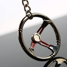 Steering wheel car keychain in chrome finish. Keychain Gear, Turbo Keychain, Car Jewelry, Jdm Accessories, Motorcycle Keychain, Car Accessories For Guys, Cool Keychains, Mini Keychain, Car Key Ring