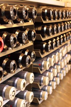 several rows of wine racks in a winery