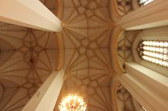 an overhead view of a chandelier in a cathedral