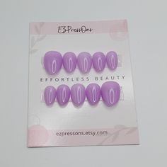 Introducing this set of extra short, almond press on nails, meticulously hand painted with gel nail polish. These nails are classified as extra short by the manufacturer but may be considered extra short or short length depending on the length of your nail bed.  COLOR: Purple NAIL SHAPE SHOWN IN PHOTOS: Extra Short Almond Nails (Una Gella) With your purchase, you will receive an application kit comprising a cuticle pusher, buffing block, alcohol prep pads, and a convenient bottle of nail glue. I Purple Nail Beds, Extra Short Almond Nails, Purple Press On Nails, Almond Press On Nails, Bed Color, Short Almond Nails, Gothic Nails, Short Almond, Goth Nails