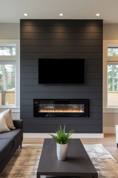 a living room with a couch, coffee table and fireplace