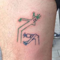 a man's leg with a tattoo on it that has a drawing of a frog