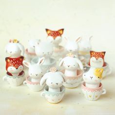 small ceramic figurines in the shape of bunnies and rabbits are on display