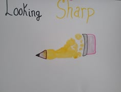 a drawing of a yellow shoe with the words looking sharp written on it and a pencil